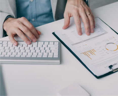 Person analyzing energy upgrade lead generation data on a clipboard