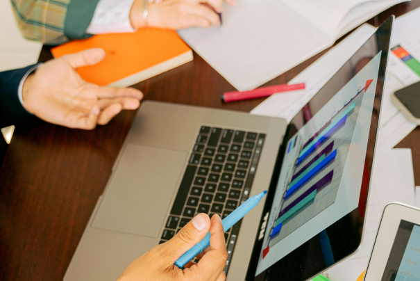 Professional reviewing compliance documentation and financial charts to ensure audit readiness.