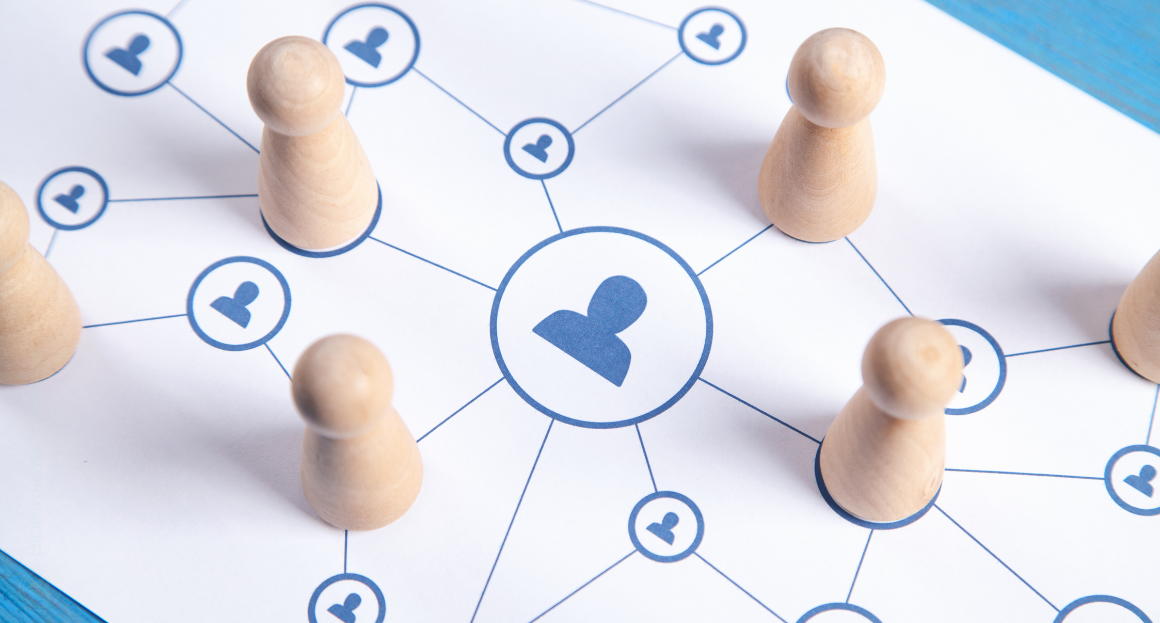 Laptop screen displaying a Google Docs marketing article with a network illustration of connected people icons.